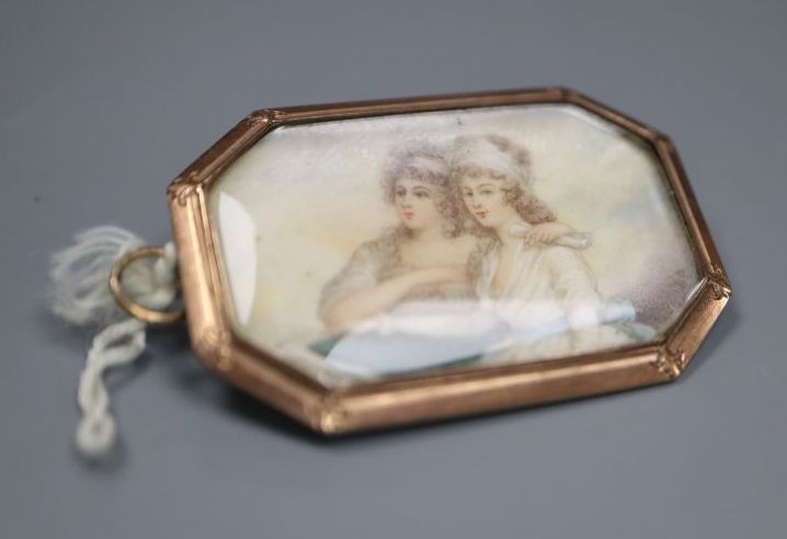 A 19th century yellow metal mounted glazed miniature portrait octagonal brooch,